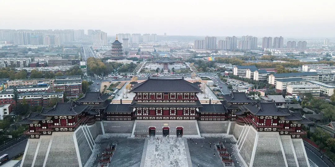Panoramic view of ancient Luoyang showing grand temples and the Yi River