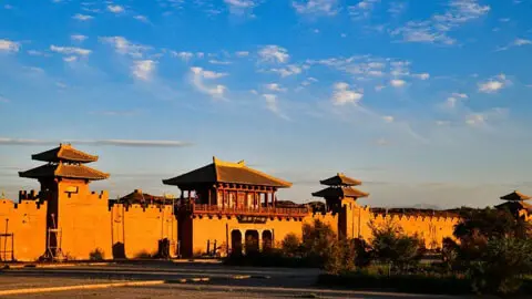 The ruins of Yumen Pass fortress standing alone in the vast Gobi desert